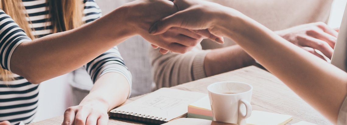 A photograph of a handshake | Smarter Travel Limited