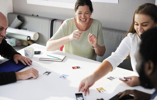 A photograph of people in an office environment looking happy | Smarter Travel Limited