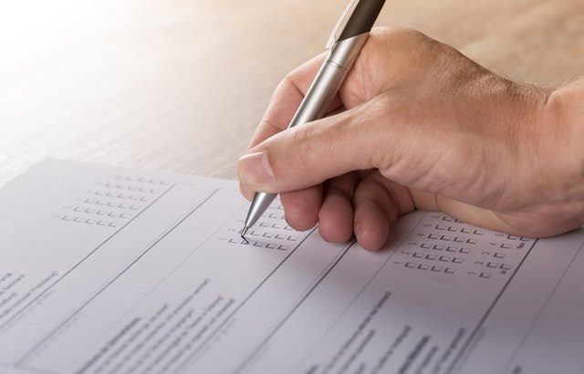 A photograph of someones arm completing a survey | Smarter Travel Limited