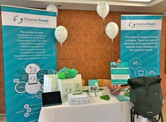A photograph of the Smarter Travel stand at the event, including pop up banners and balloons | Smarter Travel Limited