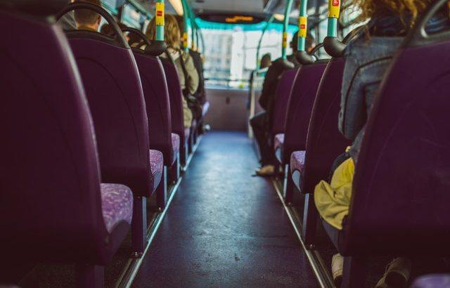 Photograph of the inside of a bus with purple seats | Smarter Travel Limited