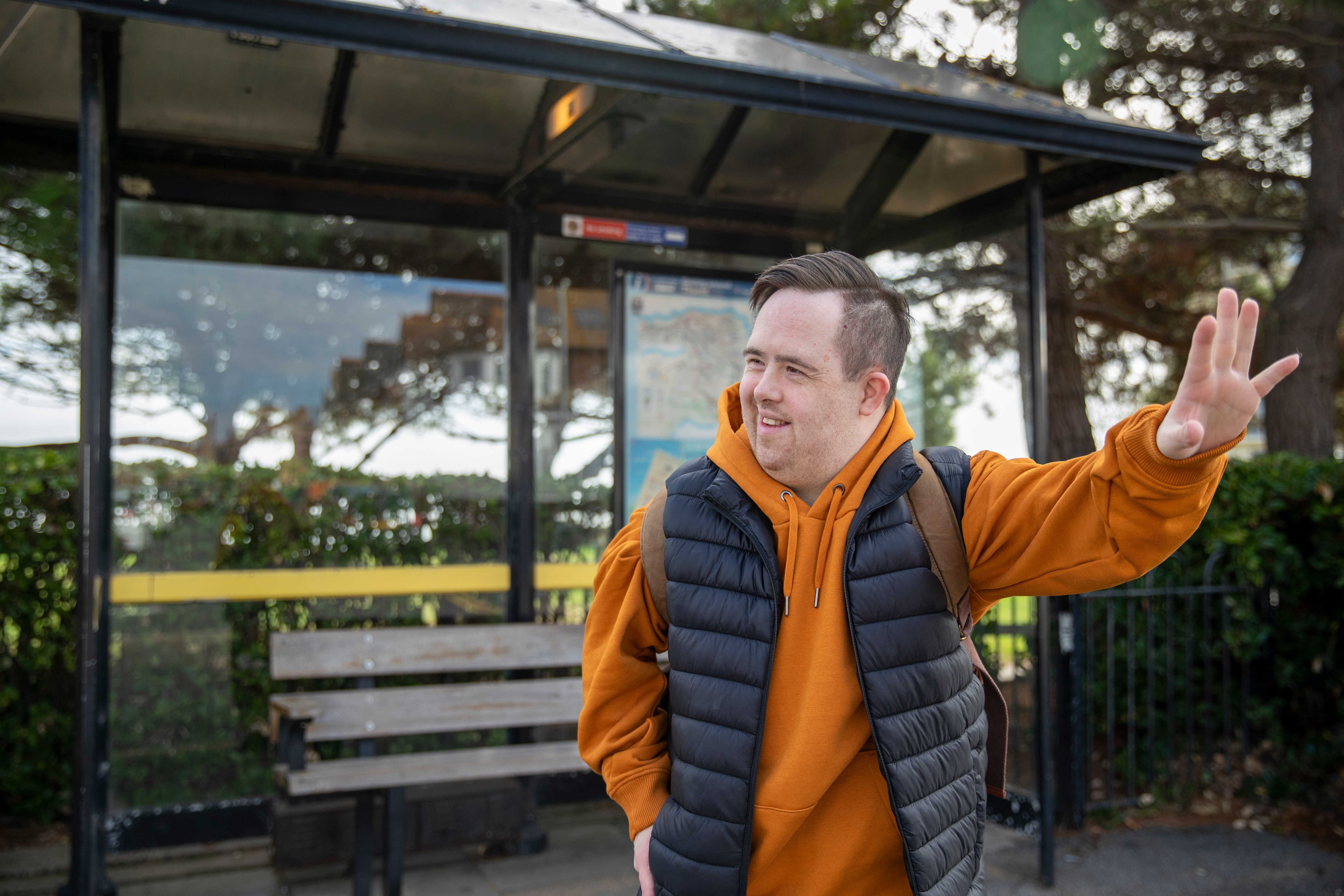 man hailing a bus